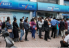 Yes Bank customers queue for cash after India’s central bank takes control